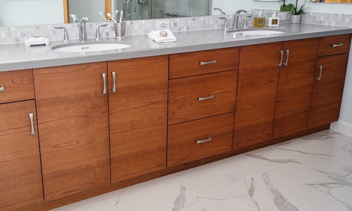 Pleasant Hill primary bath with single grain wood cabinets, quartz countertops