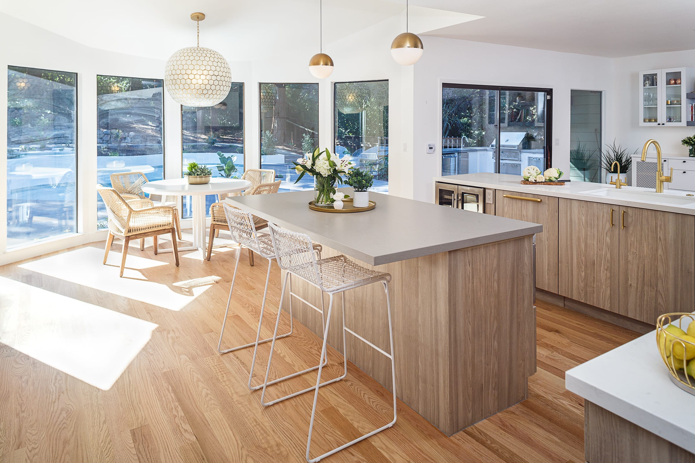 island with gray countertops space for white seating frameless cabinets, quartz countertop