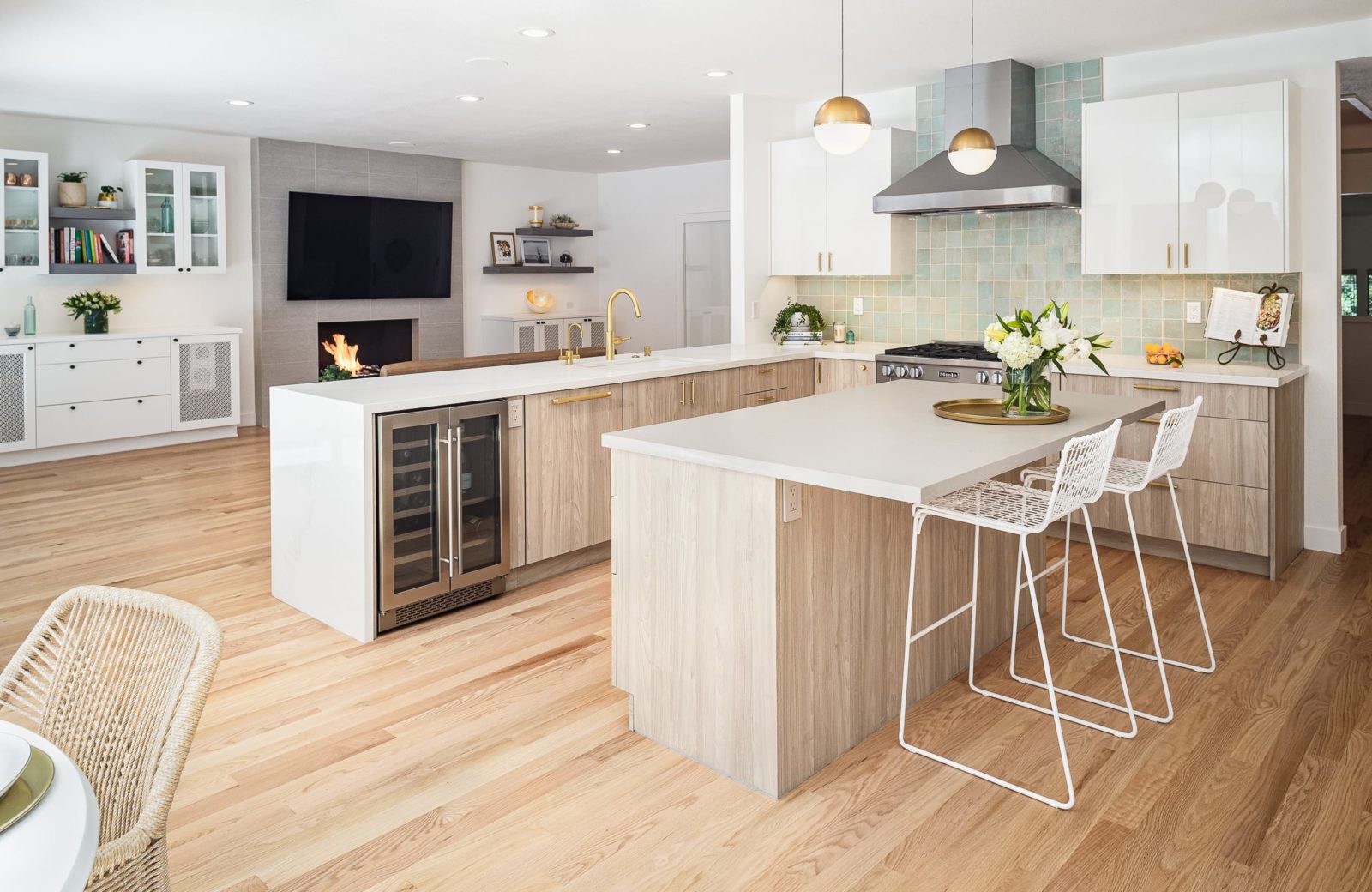 Peninsula with wine fridge, Caesarstone white countertops, frameless base cabinets