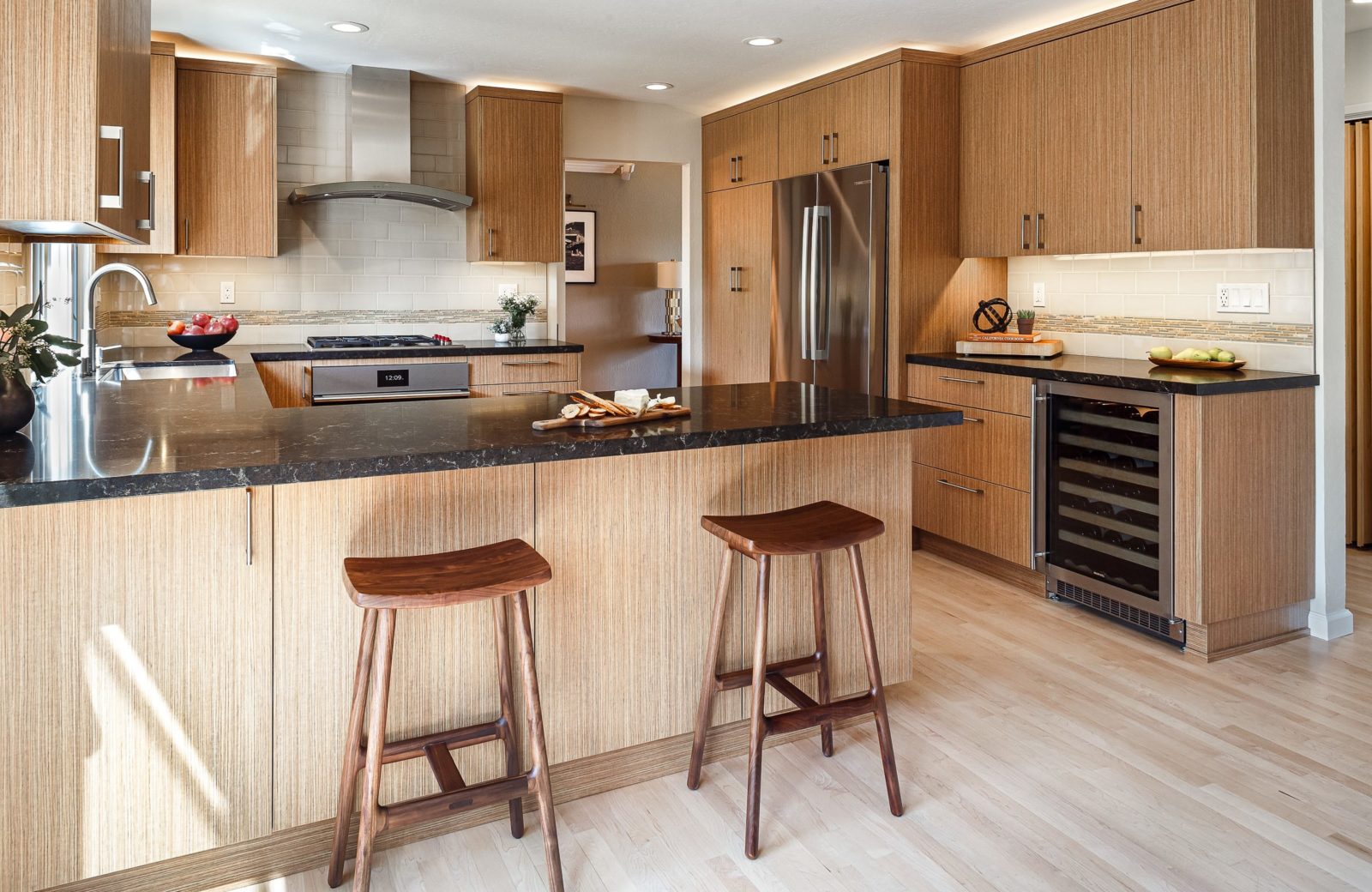Transitional kitchen with peninsula and wine fridge