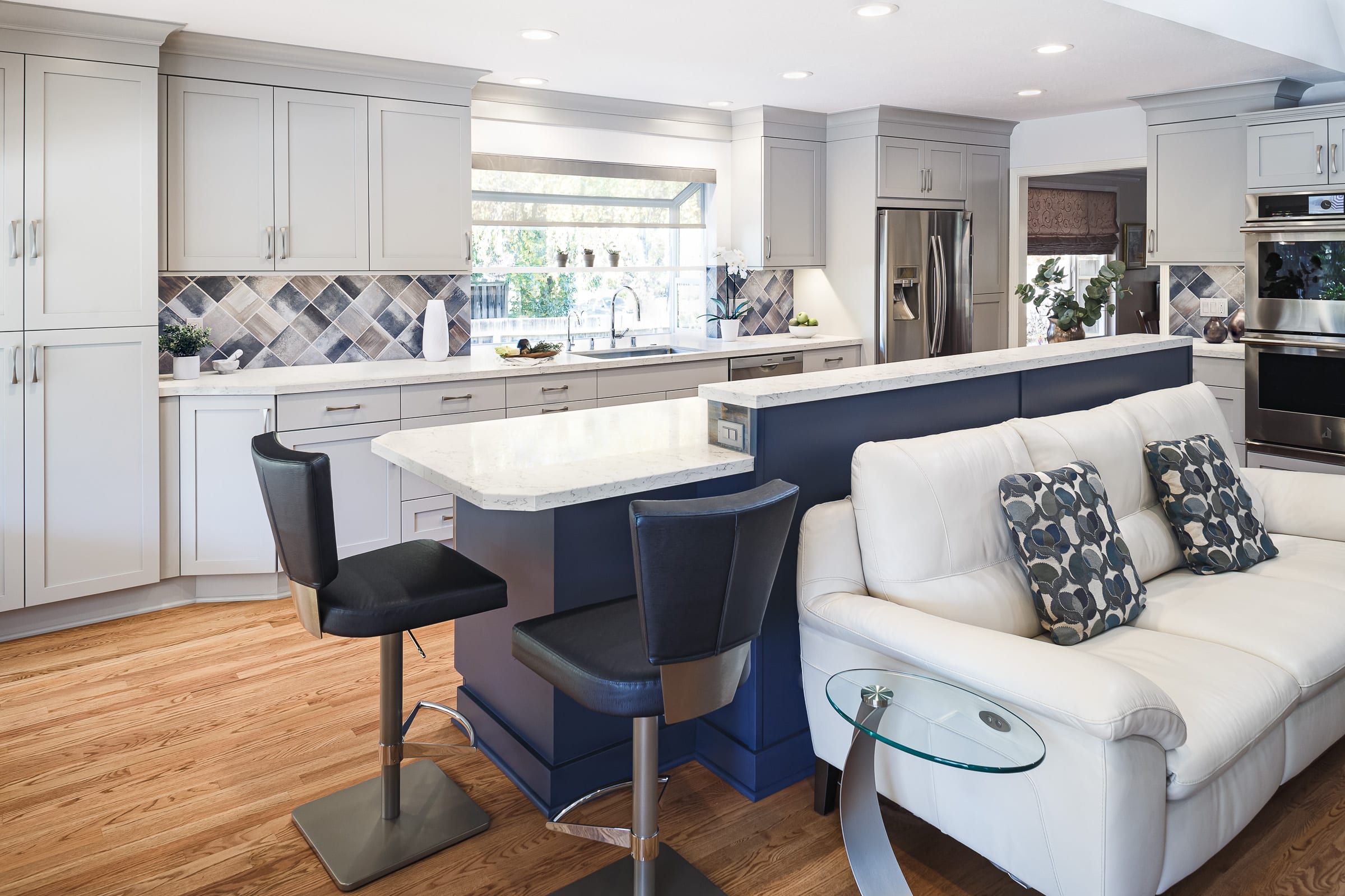 kitchen with royal blue island with overhang black chair seating for 2 on both sides of island walnut creek ca