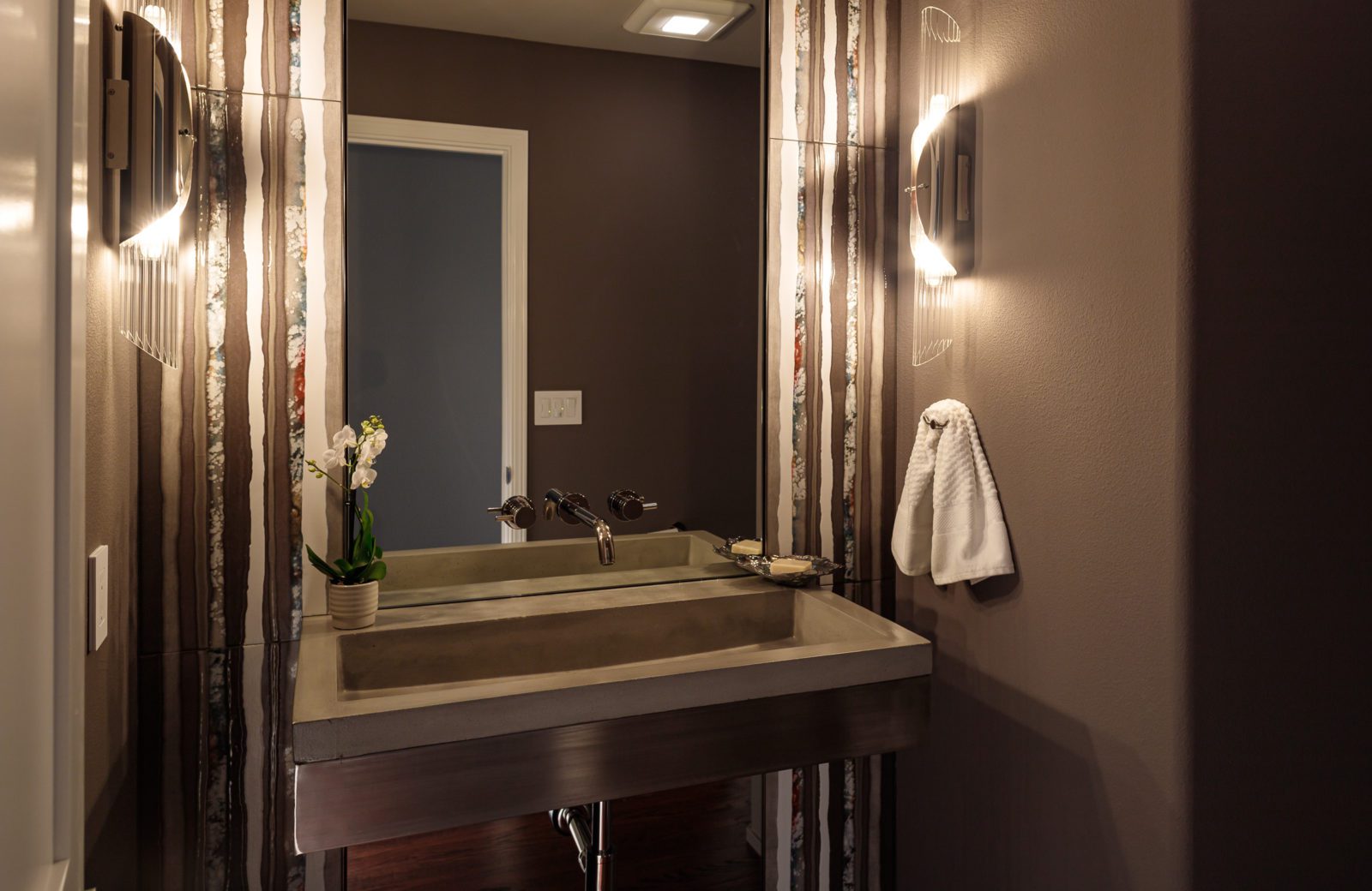 award winning dramatic half bathroom with colorful tile