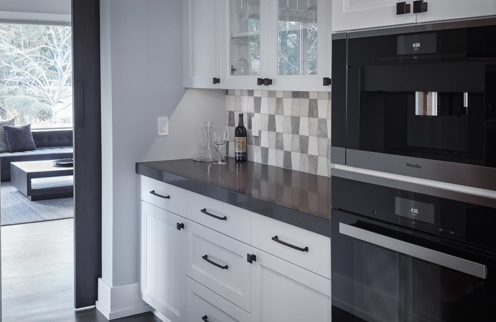 drybar with Crystal cabinets with glass doors and double ovens