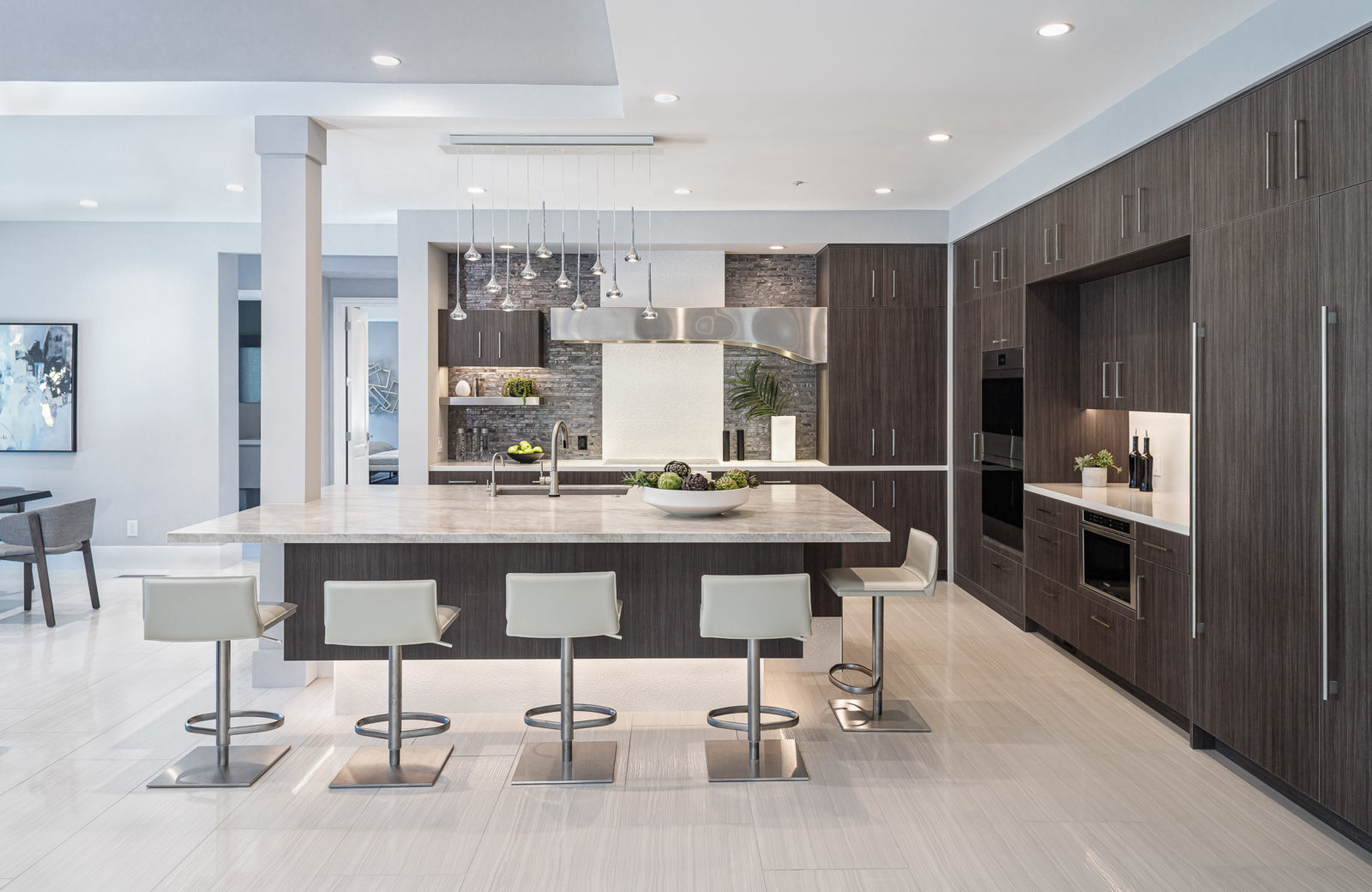 Kitchen with floating island and dark cabinets