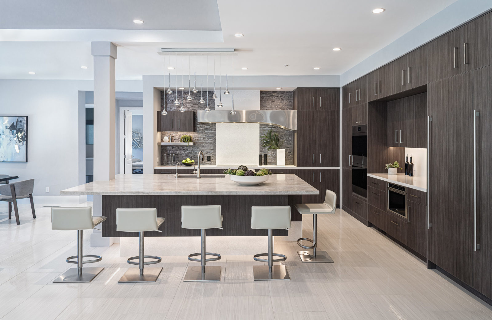 modern large dark wood and white island with seating for 5 with quartzite countertop