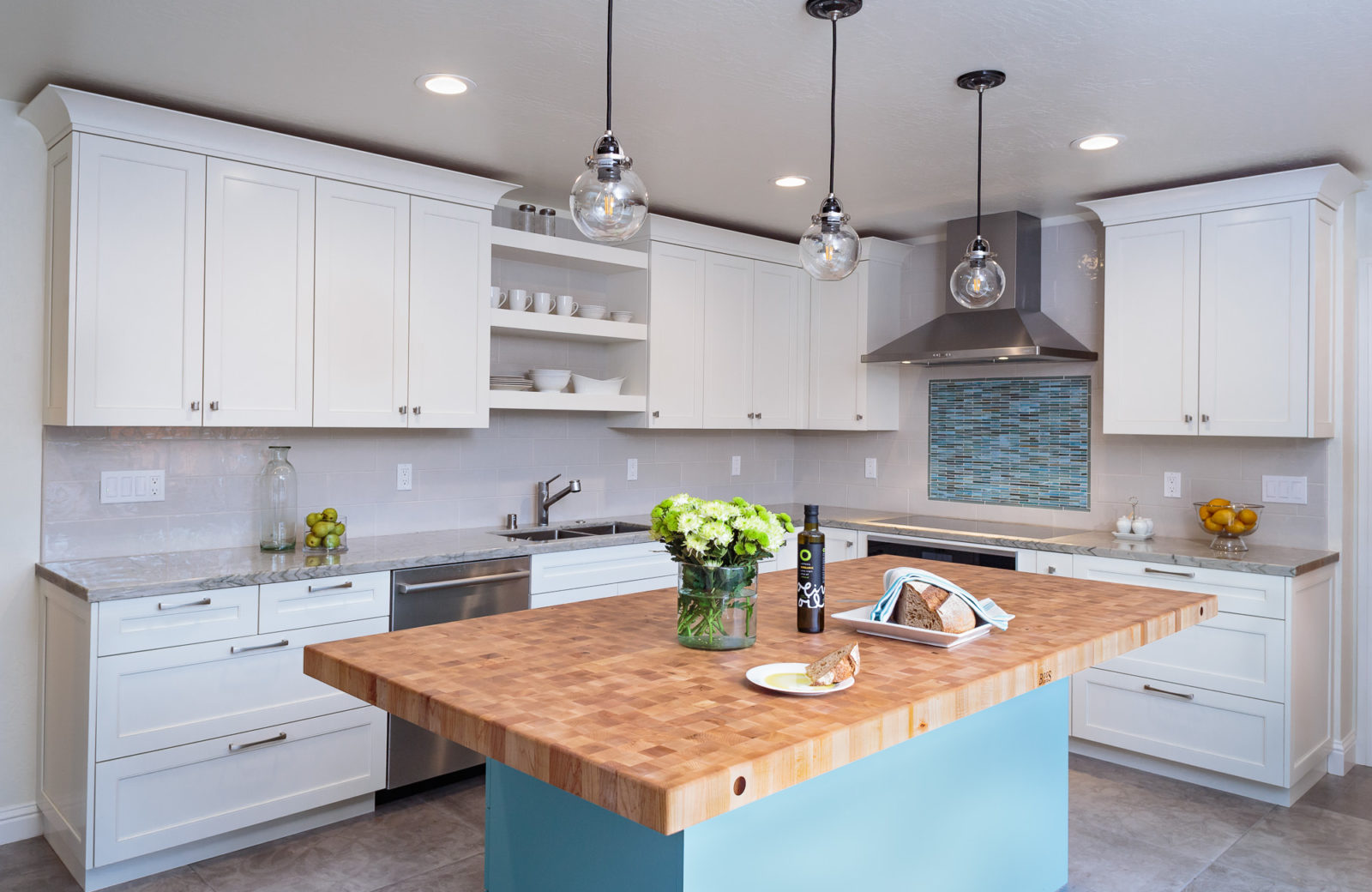 Wood island blue base white cabinets