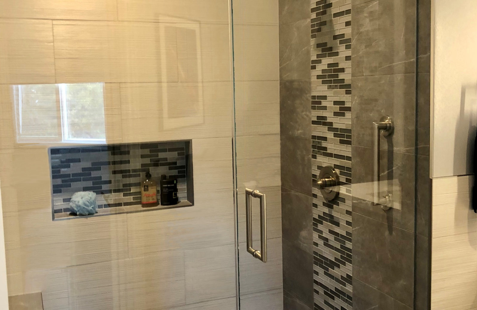 Award Winning EnSuite Bathroom remodel gray vertical accent tiled shower niche