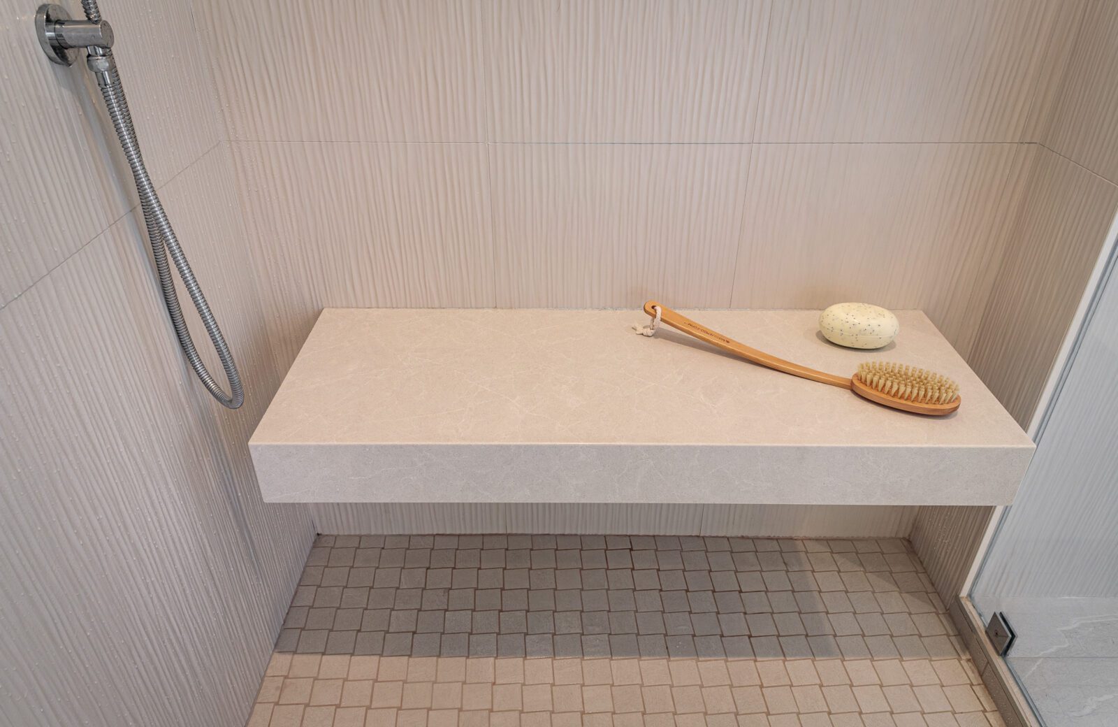 primary bath shower with floating bench