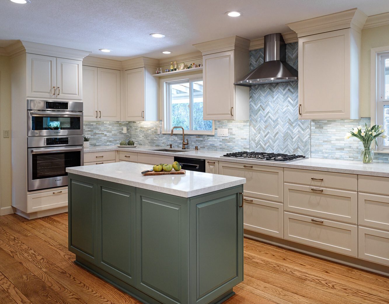 Real-world example of a narrow green kitchen island without seating