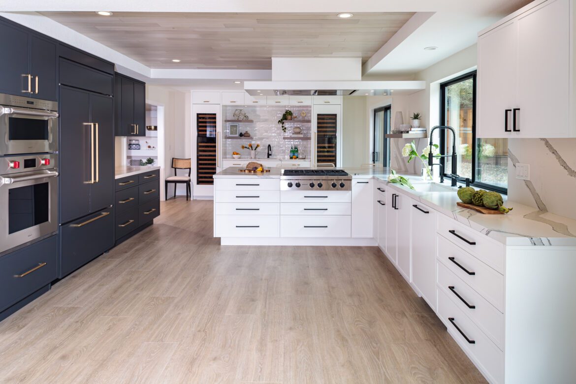 Large kitchen with white and black painted cabinets