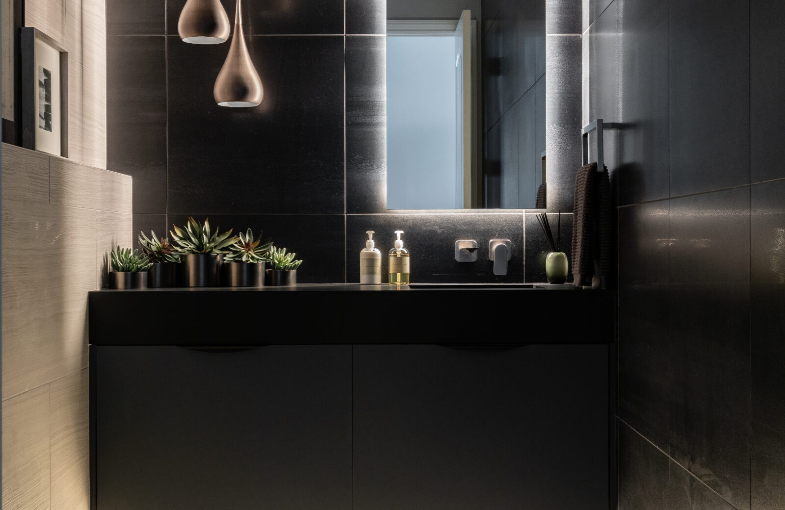 modern black powder room remodel floating vanity wall hung toilet vegas style