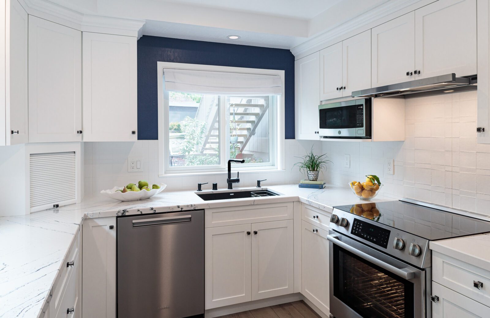 Blue and white small kitchen remodel, appliance garage and stainless steel dishwasher