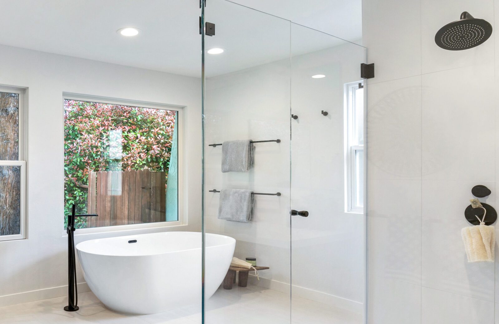 Primary Bathroom remodel, freestanding tub, tile floor, glass shower panel