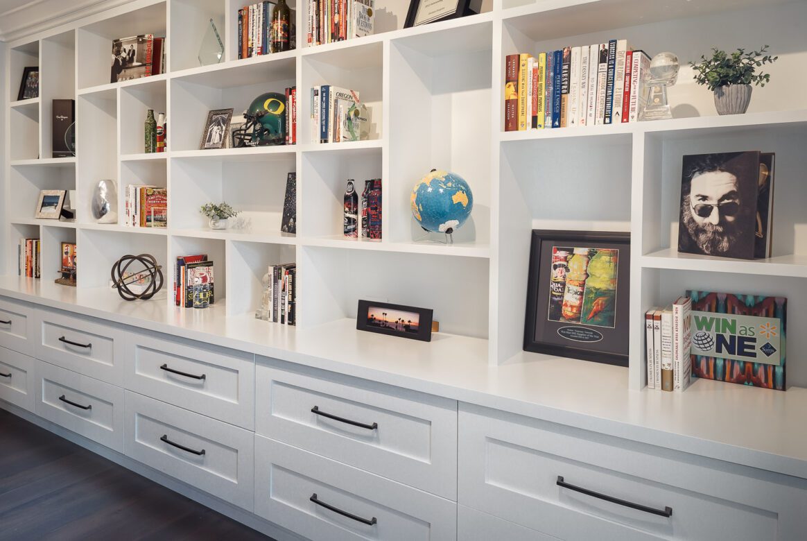 home office remodel White painted custom cabinets and bookshelves entire wall