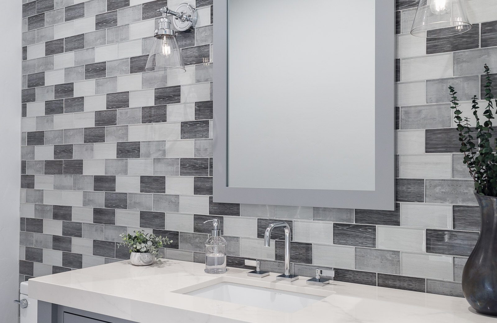 powder room remodel with gray white rectangle glass tile accent wall