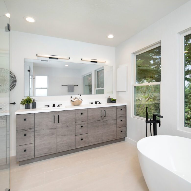 primary bathroom remodel, double vanity, black tub filler, tile floor