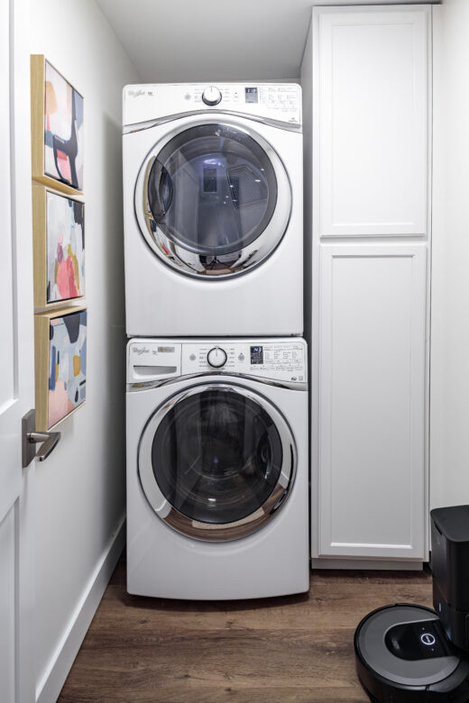 laundry room remodel white painted cabinets stackable machines