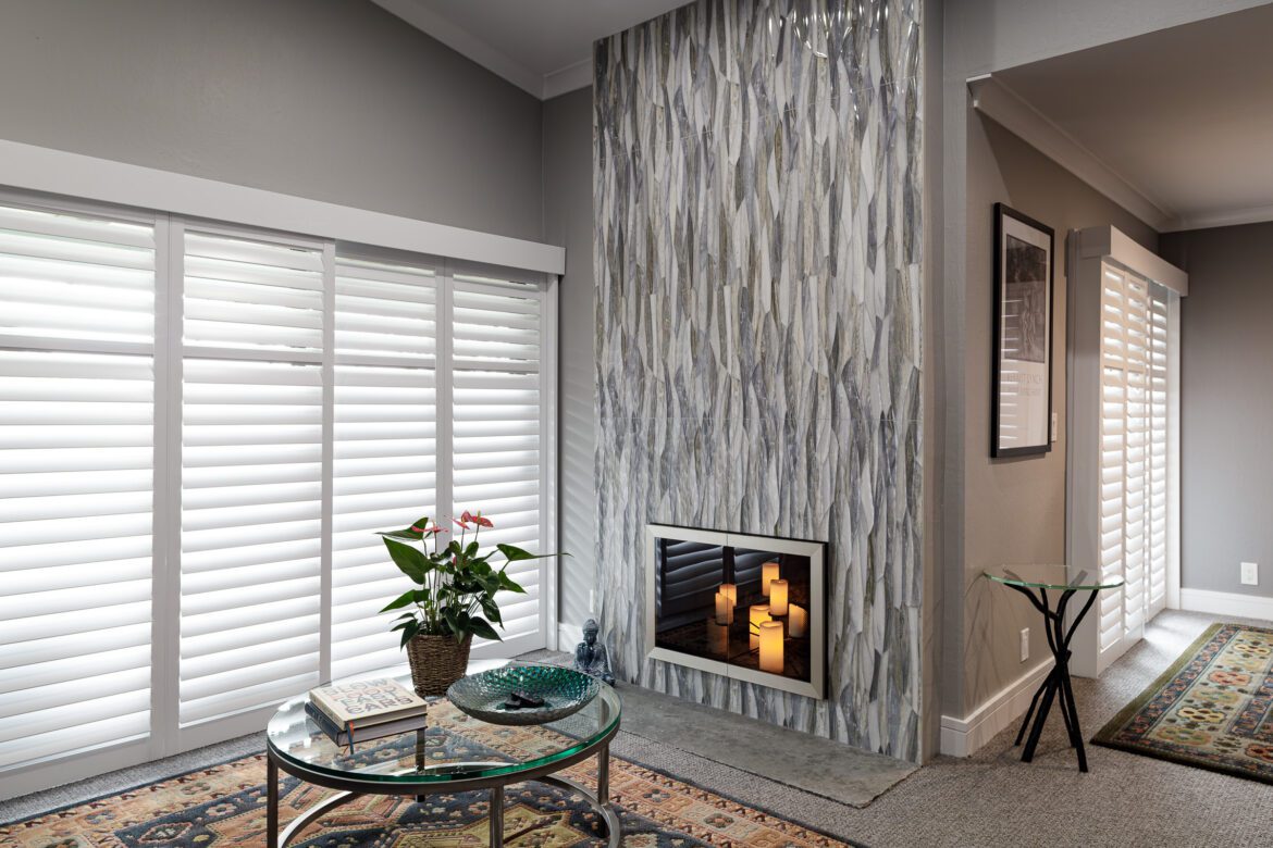fireplace remodel, vertical grey 3d tile fireplace wall, glass fireplace door