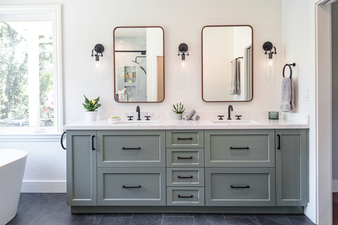 Primary bathroom remodel, Double vanity, green cabinets, sconces