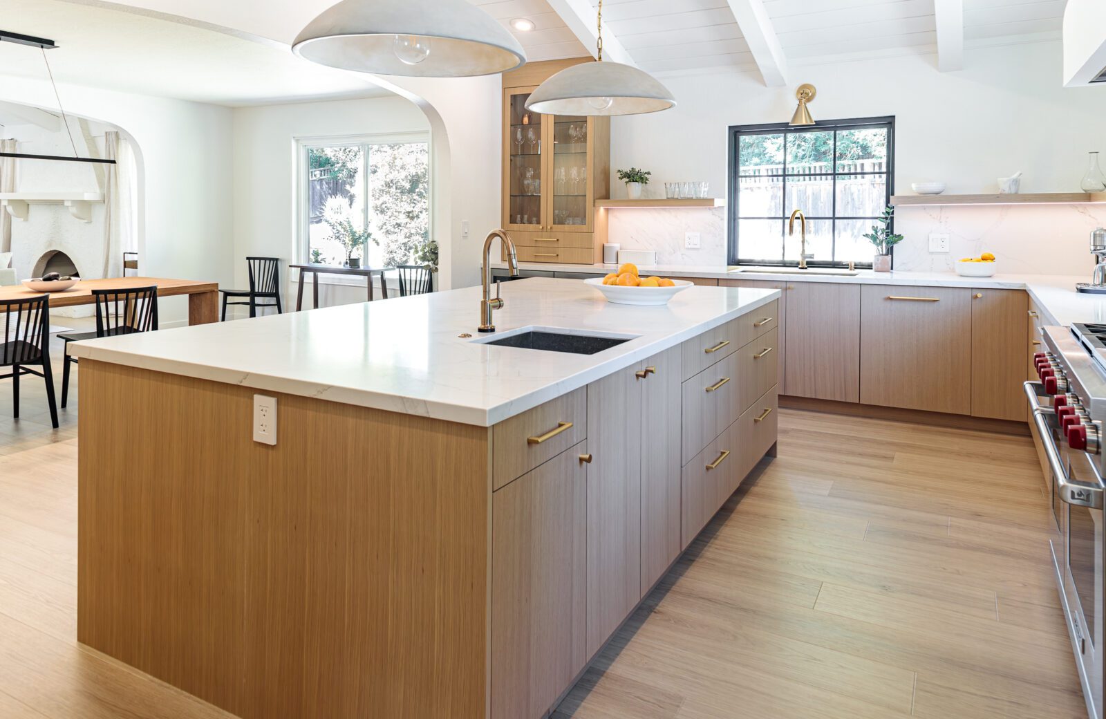 large white oak island with sink, quartz countertop