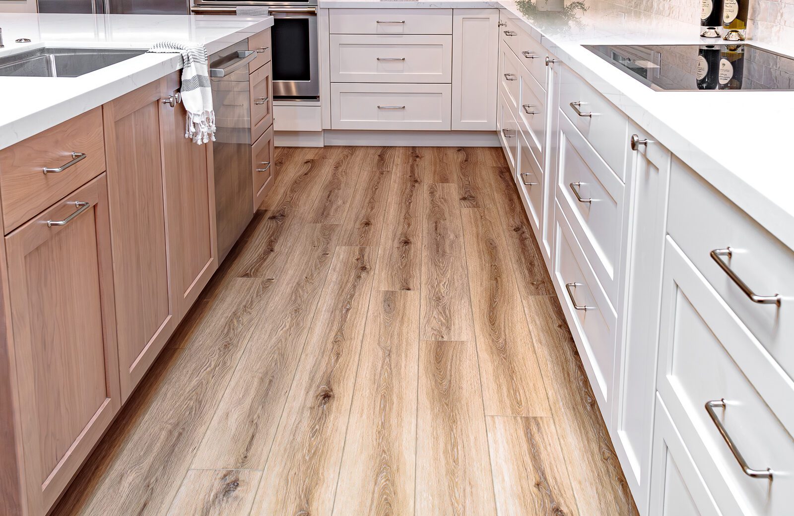 LVP floors, white shaker cabinets, wood shaker island, induction cooktop