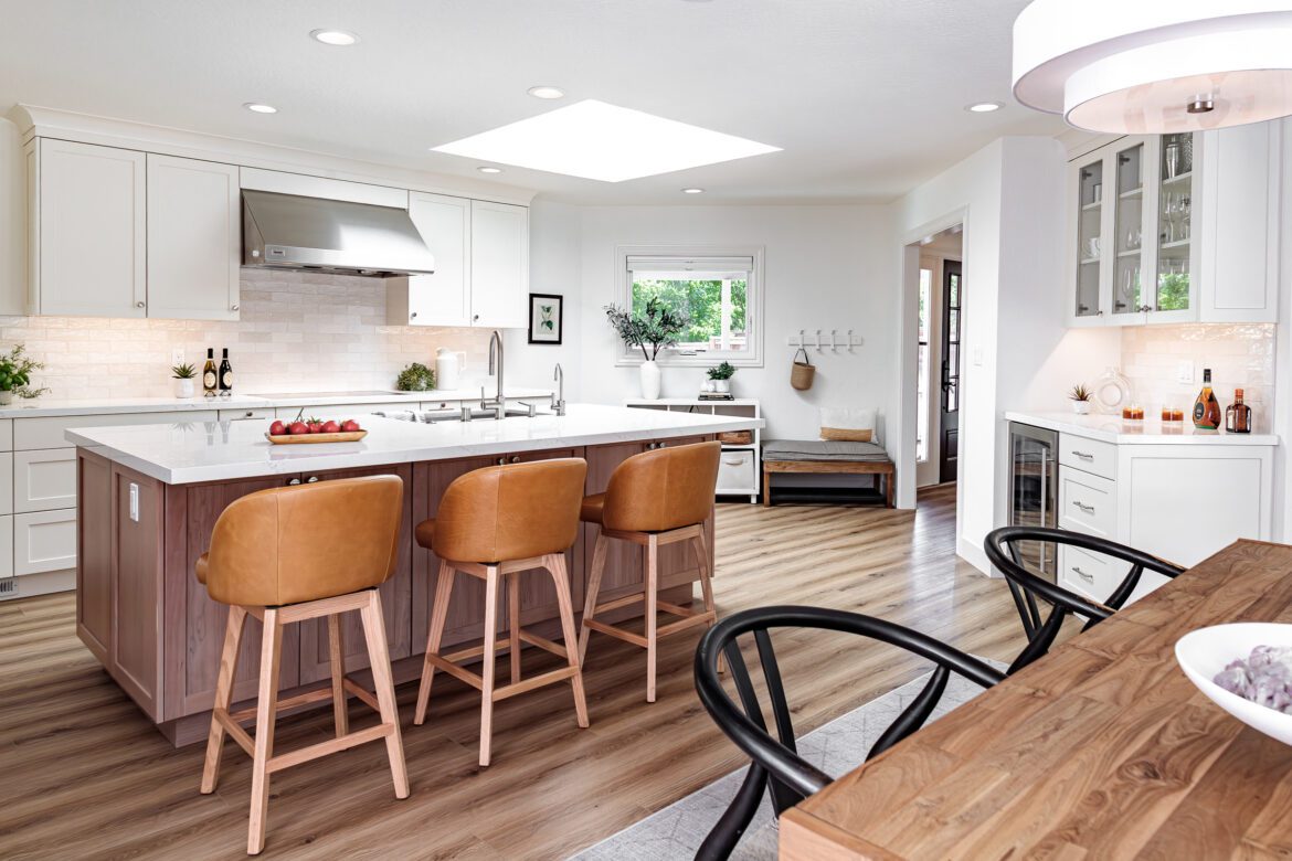 two toned cabinets, subway tile backsplash, luxury vinyl plank flooring