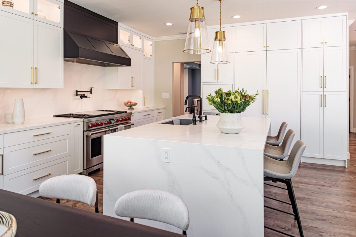 large island with waterfall countertop