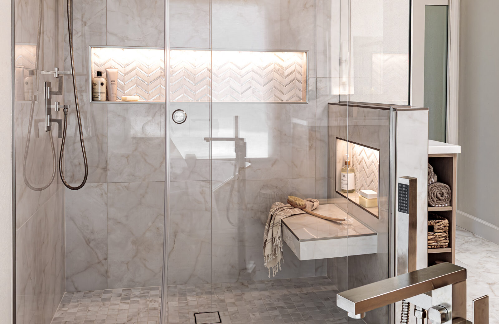 Shower with tiled bench, glass barn shower door and shower niche