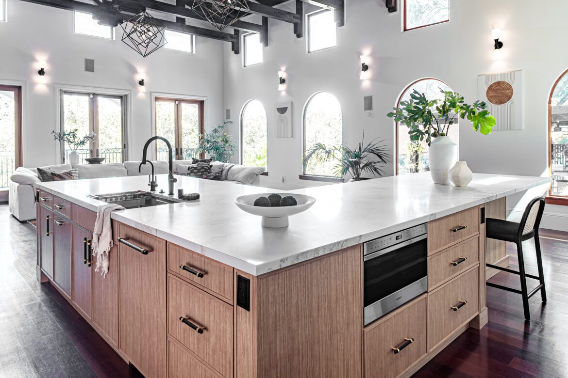 kitchen remodel with large L shaped island, microwave drawer in island, quartz countertop