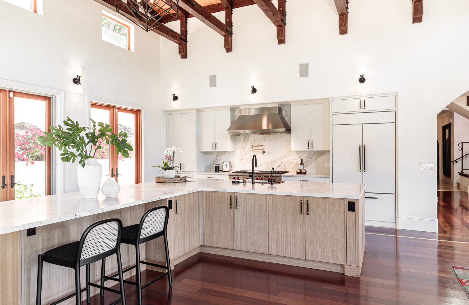 open plan kitchen remodel with L shaped island, seats at island, quartz backsplash orinda ca