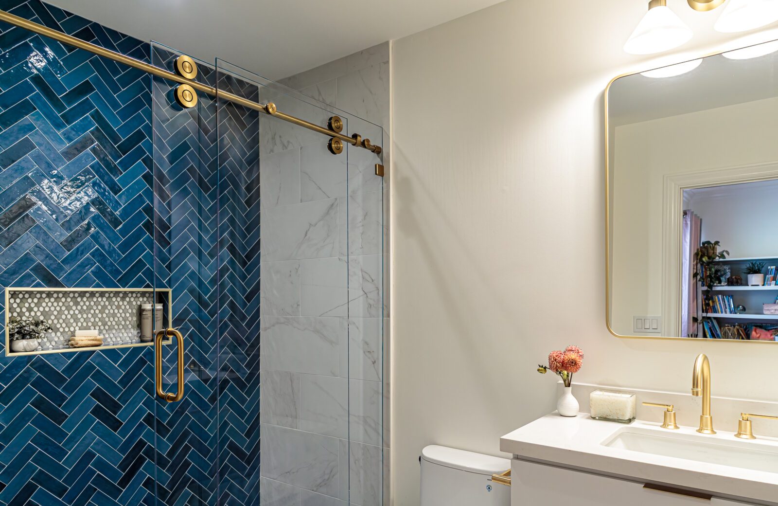 blue herringbone tile shower wall blue white bathroom remodel