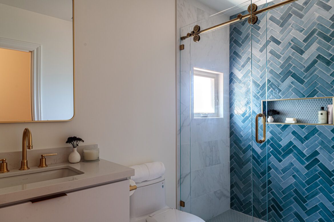 kids bathroom remodel, chevron tile wall, brass fixtures