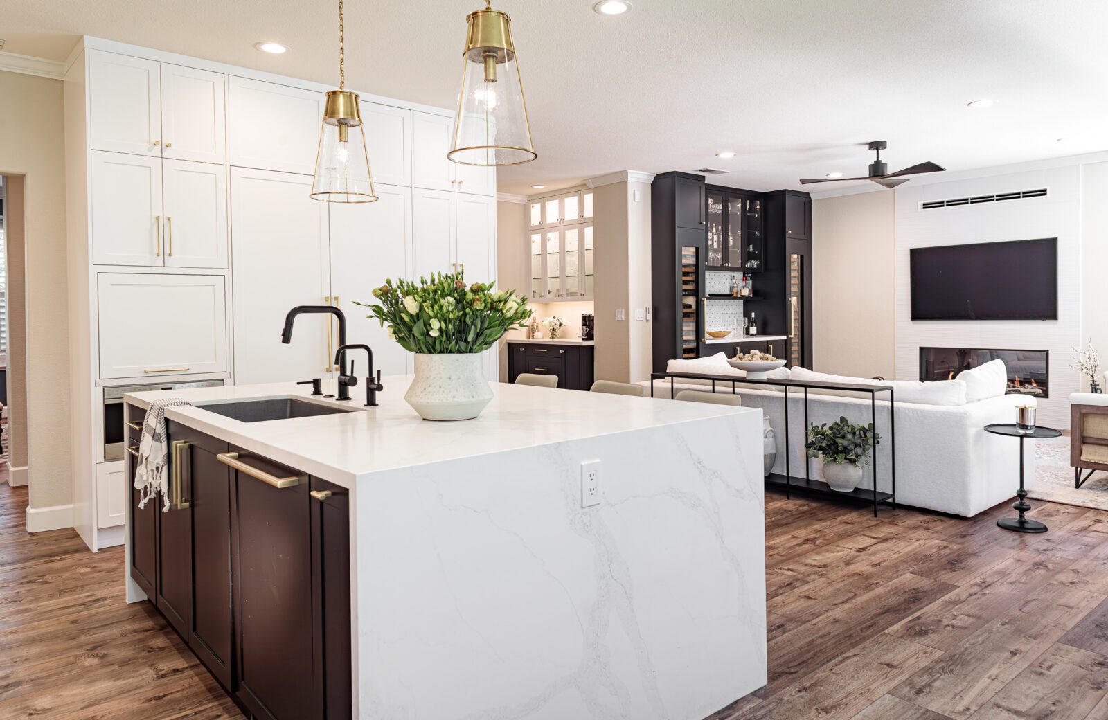 Open plan kitchen with built in bar with 2 tall Miele wine fridges