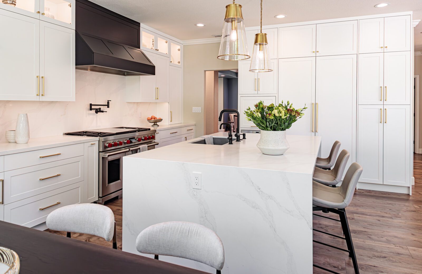 large island with quartz waterfall countertop