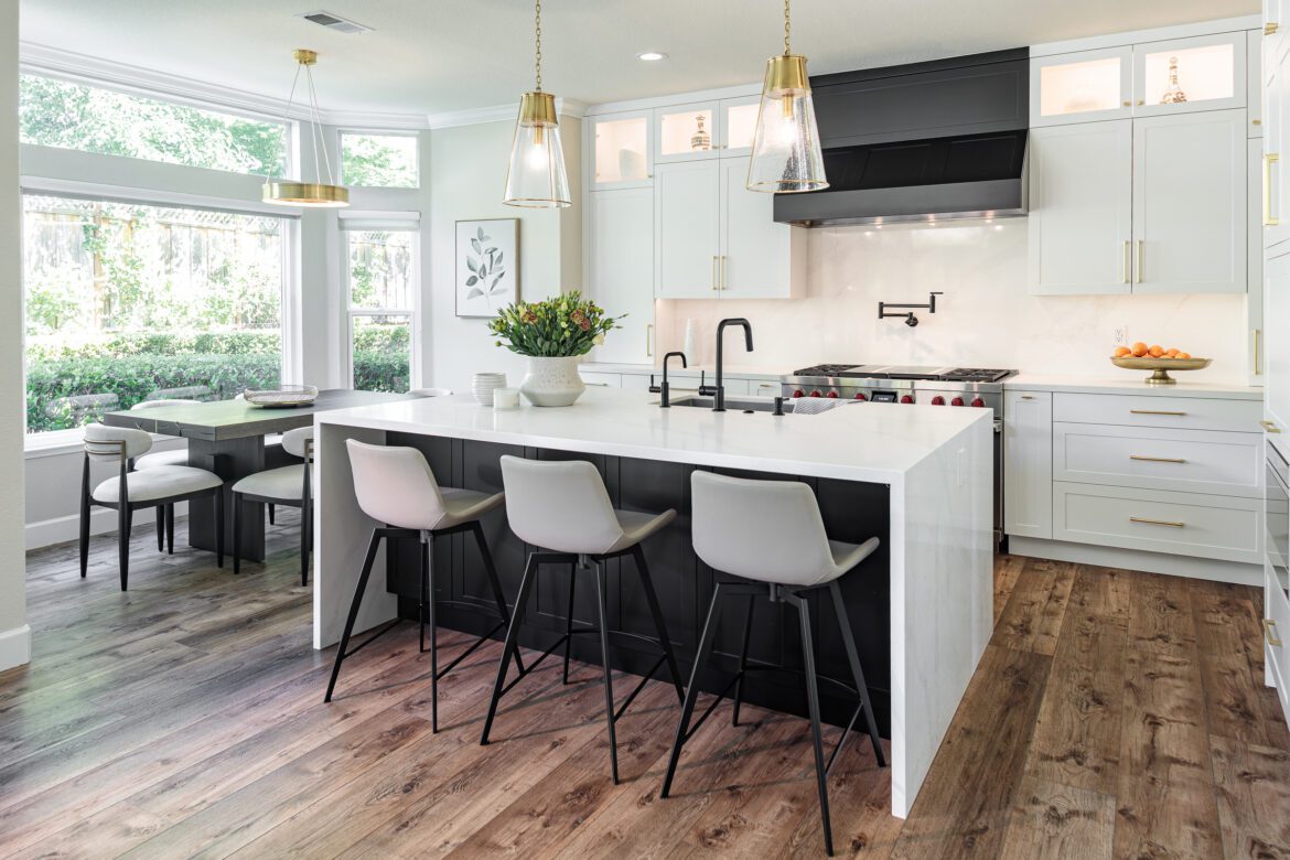 two toned kitchen cabinets, quartz waterfall countertops