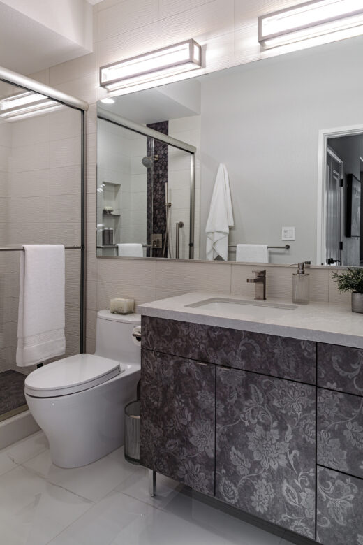 guest bathroom with custom vanity and full wall mirror