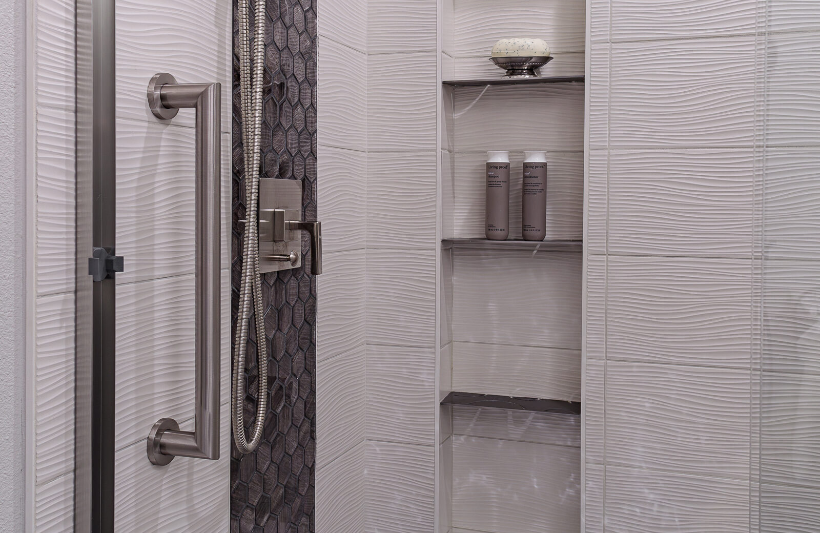 guest bathroom remodel with shower niche, tile accents