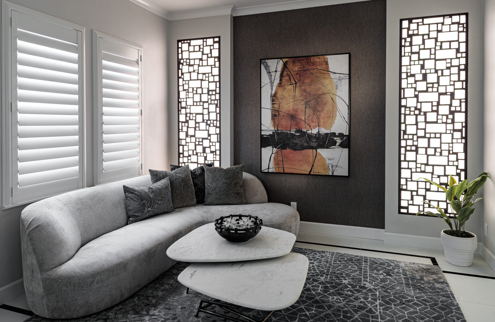 custom entryway lounge area with lighted cutout wood panels