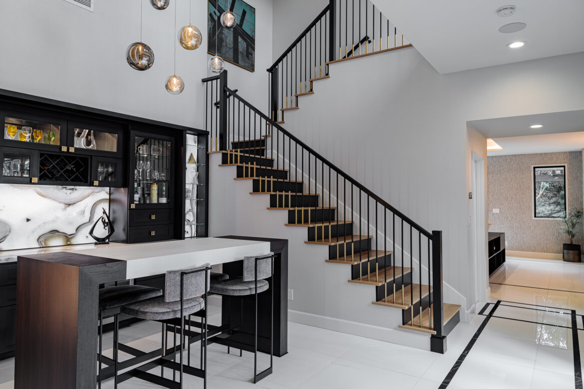 Custom modern staircase with wood treads, metal railing