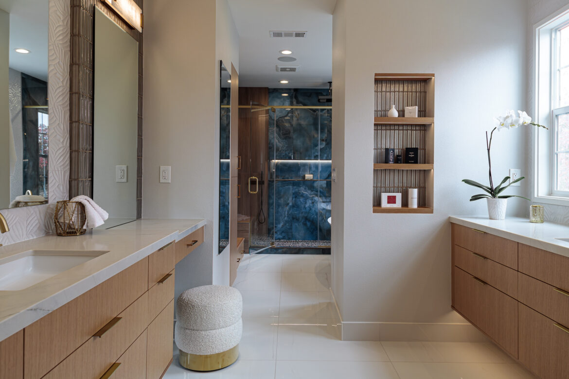 primary bathroom shower with large format blue tile, linear drain
