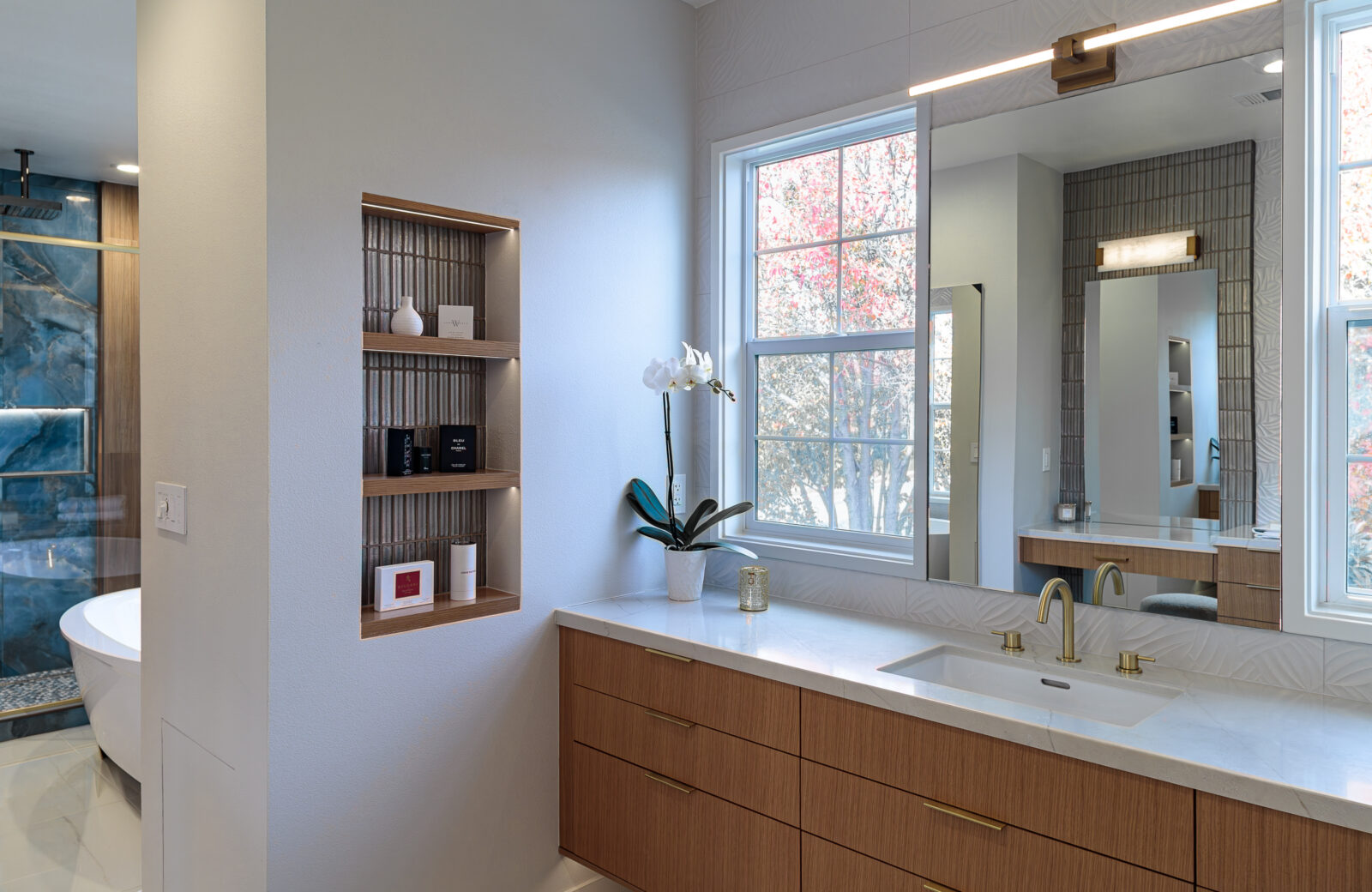 wood vanity with inset wall niche