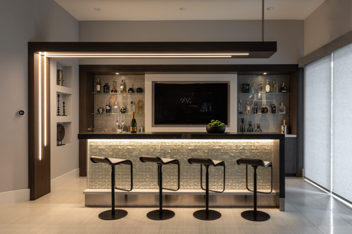 Ruby Hill home bar remodel, Flyover panel with integrated LED lighting, Custom entertainment bar, Custom cabinetry for barware and glassware